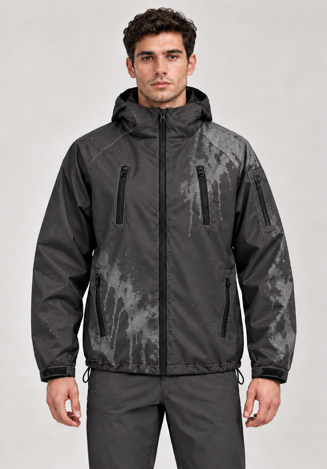 Studio model wearing Black / Grey jacket with localized thermochromic colour reveal